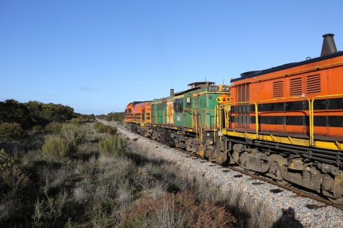 130705 0657
Lock, 1203, 846 and 859 depart along the mainline for Port Lincoln with the loaded grain train.

