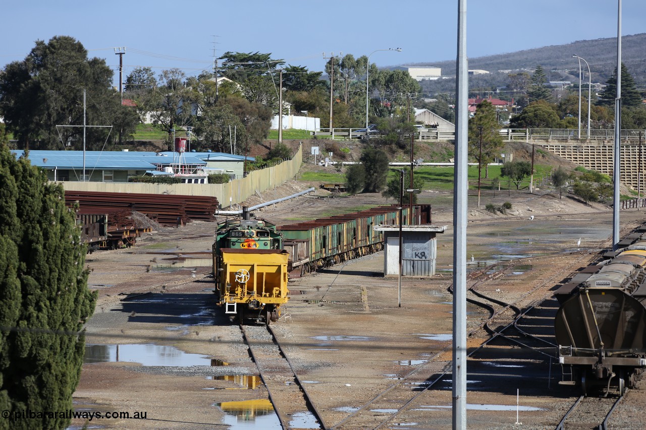 130706 0667
Port Lincoln, looking in the down direction from the London Street overbridge at the weigh bridge and stowed 830 class units and the ballast waggons. 6th of July 2013.
