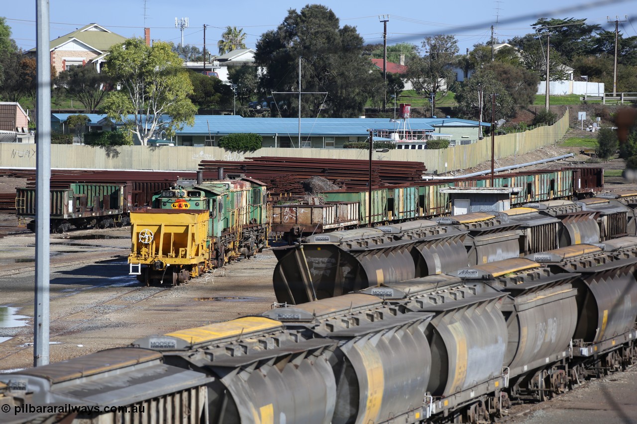 130706 0669
Port Lincoln, looking in the down direction from the London Street overbridge at the weigh bridge and stowed 830 class units and the ballast waggons. 6th of July 2013.
