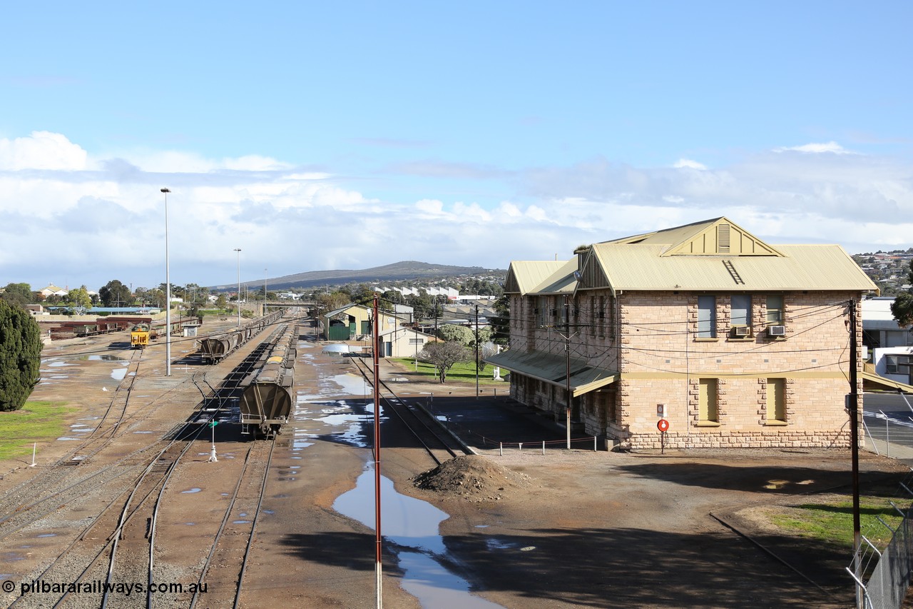 130706 0674
Port Lincoln, looking in the down direction from the London Street overbridge at the yard environs with the station at right which was Eyre Peninsula 'head offices'. 6th of July 2013.
