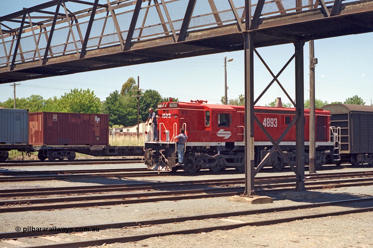 100-18
Albury yard, NSWSRA standard gauge 48 class 4893 AE Goodwin ALCo model DL531 serial G3420-8, red terror livery, shunters riding loco. [url=https://goo.gl/maps/GD6wj4qXeCg5BFzr7]Geodata[/url].
Keywords: 48-class;4893;AE-Goodwin;ALCo;DL531;G3420-8;