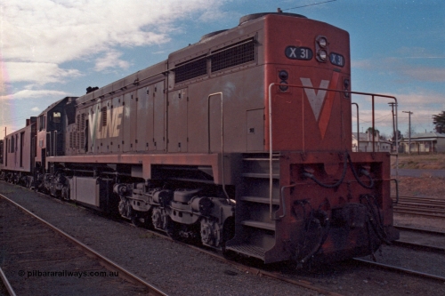 101-14
Maryborough, broad gauge V/Line X class leader X 31 Clyde Engineering EMD model G16C serial 66-484 long end leading, ballast train.
Keywords: X-class;X31;Clyde-Engineering-Granville-NSW;EMD;G16C;66-484;