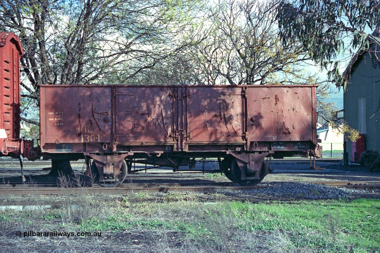 103-20
Benalla Workshops, Victorian Railways broad gauge G type four wheel open waggon G 130, originally built by Ballarat North Workshops December 1939 as a GY type GY 130, recoded to G November 1981, and 'Off Register' 1986. Photo date 12-08-1990.
Keywords: G-type;G130;Victorian-Railways-Ballarat-Nth-WS;GY-type;fixed-wheel-waggon;