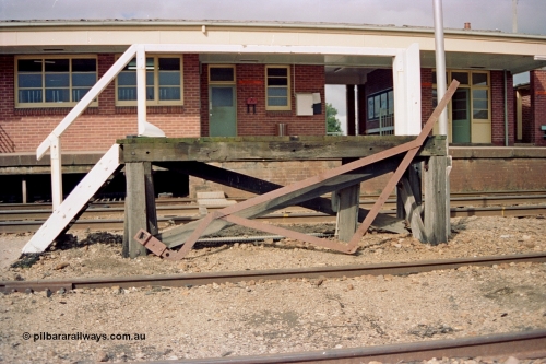 103-04
Springhurst station building overview, staff exchange platform and walkway across tracks, apparatus set up gauge, signal levers visible in windows, staff exchange box on station wall.
