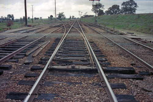 103-10
Springhurst station yard view looking north, mainline points on No.2 Rd for the Wahgunyah line have been spiked and clipped normal, standard gauge flyover on right, yard being rationalised, note redundant disc signal post 5 on ground.
