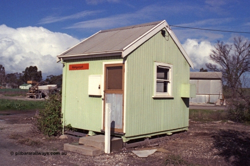 103-15
Wahgunyah portable station building, staff hut, 3/4 view, super phosphate shed and unloading contraption in the background.
