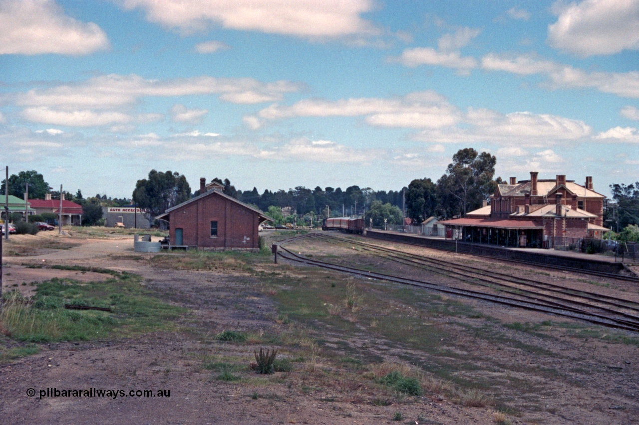 104-04
Stawell station yard overview, goods shed at left, Dimboola pass departing crossing Seaby St.
