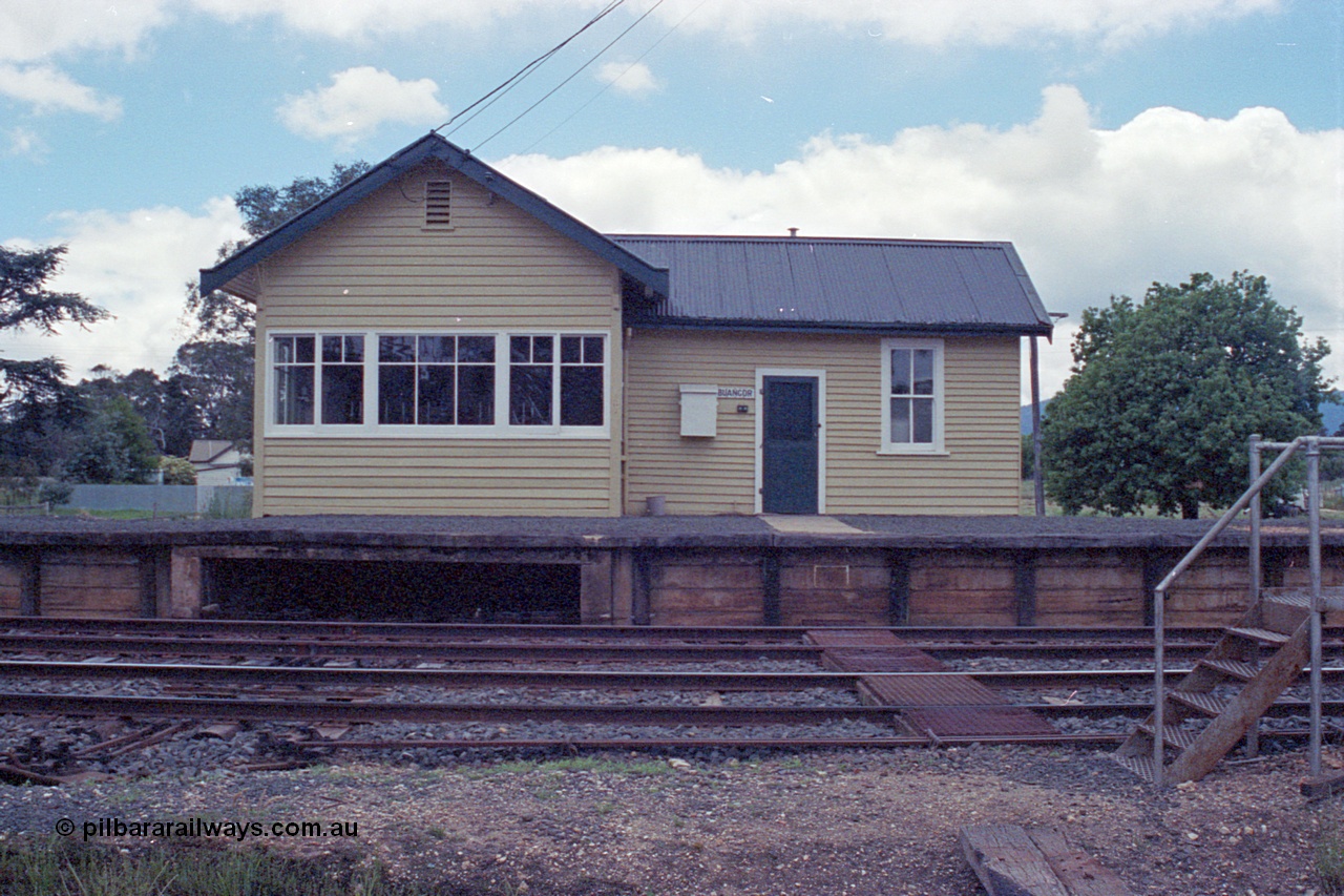 104-12
Buangor station building front elevation, signal box at left, rodding and wires leaving platform opening, staff exchange platform at right.

