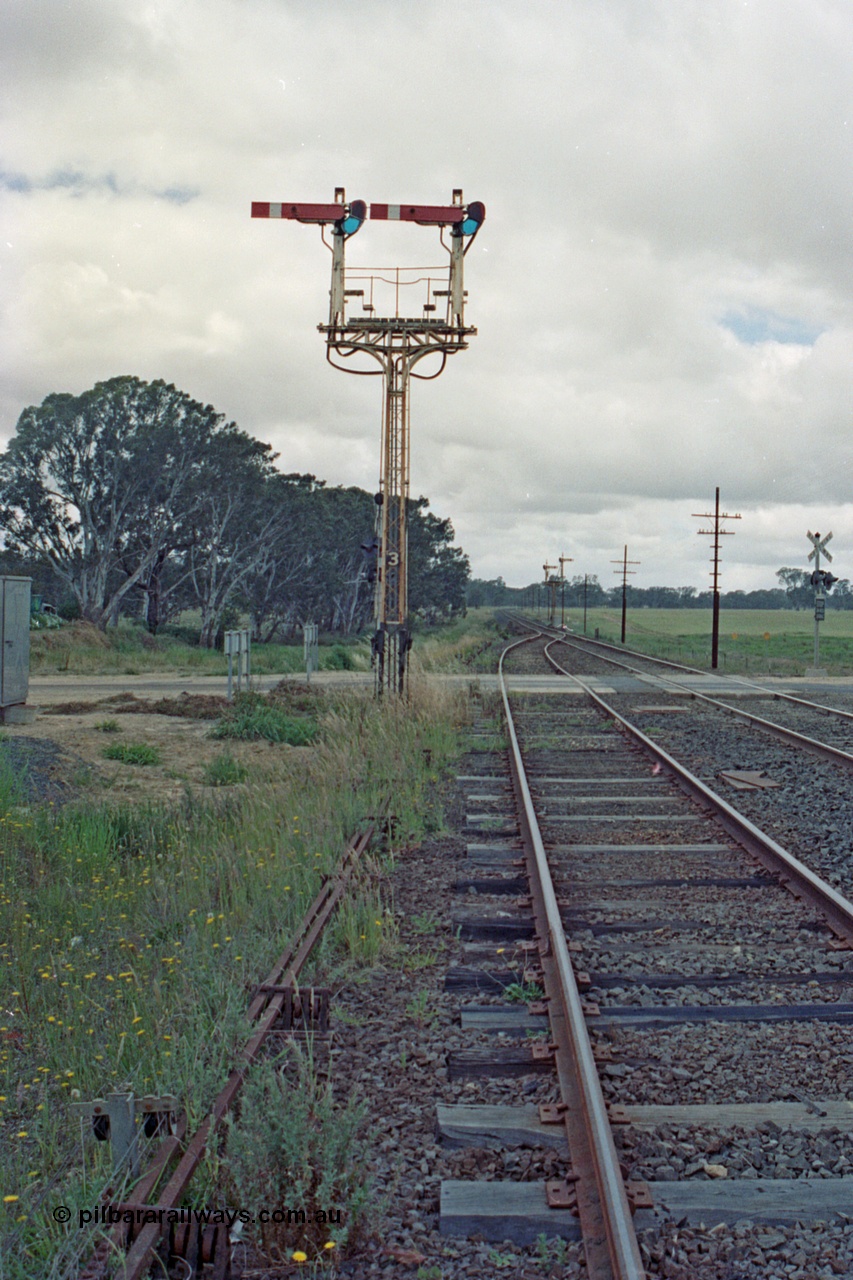 104-14
Buangor crossing loop, yard view looking east, mechanical somersault semaphore signal post 3, Up Home, facing camera for Melbourne bound trains, mechanical somersault semaphore signal post 2, Down Home, in the distance for Ararat bound traffic.

