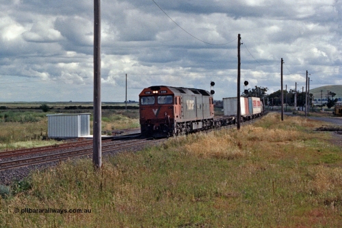 104-19
Wallan Loop, standard gauge V/Line G class loco G 515 with serial 85-1243 a Clyde Engineering Rosewater SA built EMD model JT26C-2SS leads a down Albury bound goods, standard gauge gangers trolley shed on the loop line.
Keywords: G-class;G515;Clyde-Engineering-Rosewater-SA;EMD;JT26C-2SS;85-1243;