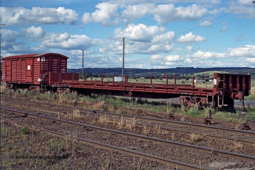 104-24
Wallan, V/Line broad gauge VFLX type bogie bulk end flat waggon VFLX?? loaded with rail and a VLBY type bogie louvre van on No.3 Rd. The VFLX is fitted with a lashing rail, possibly ex SFX / VFMX panelboard flat waggon.
Keywords: VFLX-type;VLBY-type;Victorian-Railways-Newport-WS;FLX-type;