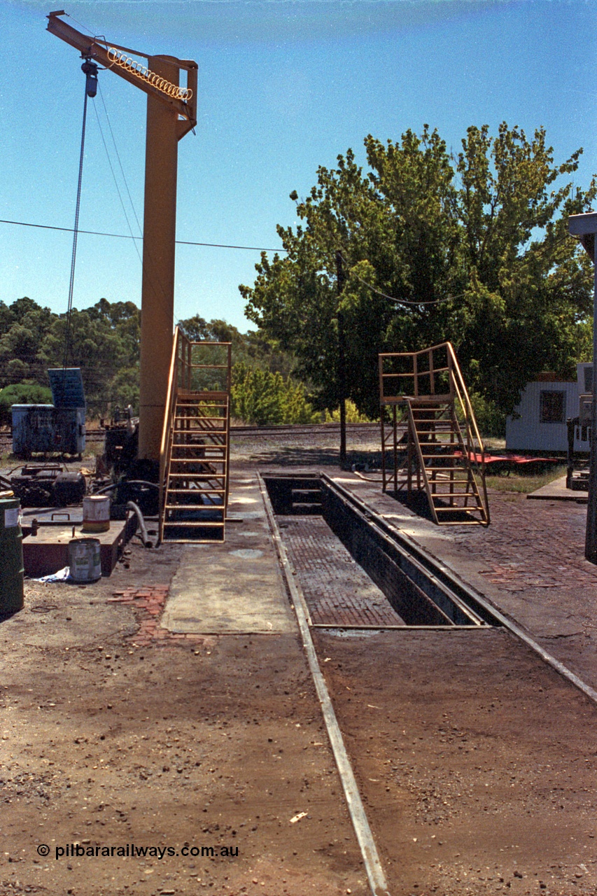 105-31
Seymour loco depot inspection pit road with davit hoist and portable inspection walkways.
