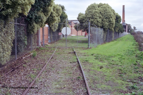 107-02
Kyabram track view, Kyabram Co-op Fruit Preserving Company and Southern Can Company sidings and factory gates, point rodding and derailer.

