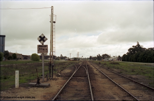 107-12
Tongala station yard, Nestle factory siding with staff locked points looking north, 20 MPH speed board.

