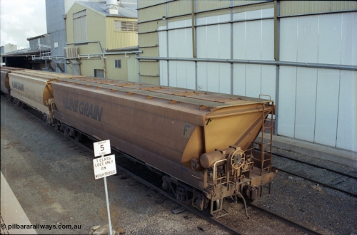 107-25
Echuca yard view, Sidings A, broad gauge V/Line Grain VHGF type bogie grain waggon VHGF 575, hand brake end and roof detail, elevated view, weighbridge road.
Keywords: VHGF-type;VHGF575;