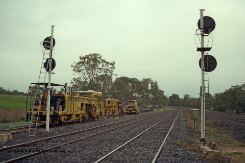 109-05
Broadford Loop, standard gauge, track machines, tamper, regulator, looking south, new signals.
Keywords: track-machine;