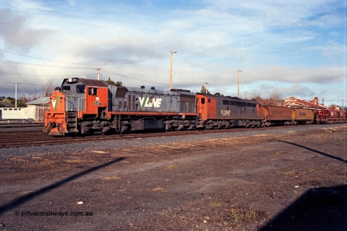109-12
Seymour, rationalised yard view with V/Line broad gauge stabled grain train, X class X 47 Clyde Engineering EMD model G26C serial 75-794 and S class S 307 'John Pascoe Fawkner' Clyde Engineering EMD model A7 serial 57-171, V/Line Grain VHGF type bogie grain waggons.
Keywords: X-class;X47;Clyde-Engineering-Rosewater-SA;EMD;G26C;75-794;