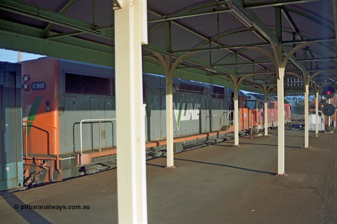 110-19
Albury station platform, V/Line standard gauge C class C 503 Clyde Engineering EMD model GT26C serial 76-826 and NSWSRA 81 class 8171 Clyde Engineering EMD model JT26C-2SS serial 85-1090 with an up goods train waits departure time south, signal at right of frame is for the broad gauge passenger platform.
Keywords: C-class;C503;Clyde-Engineering-Rosewater-SA;EMD;GT26C;76-826;81-class;8171;JT26C-2SS;85-1090;