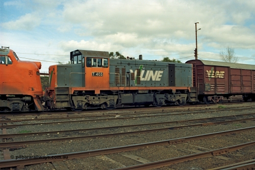 110-05
Benalla yard view, broad gauge V/Line T class loco T 403 with serial 67-498 a Clyde Engineering Granville NSW built EMD model G18B stabled down Wodonga goods train 9303, point rodding, VLCX type bogie louvre van.
Keywords: T-class;T403;Clyde-Engineering-Granville-NSW;EMD;G18B;67-498;