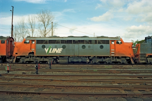 110-06
Benalla yard view, broad gauge V/Line B class B 64 Clyde Engineering EMD model ML2 serial ML2-5, side view, stabled down Wodonga goods train 9303, ground dwarf disc signals, point indicator.
Keywords: B-class;B64;Clyde-Engineering-Granville-NSW;EMD;ML2;ML2-5;bulldog;
