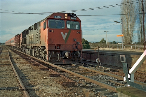 110-16
Springhurst, V/Line broad gauge N class N 468 'City of Bairnsdale' Clyde Engineering EMD model JT22HC-2 serial 86-1197 with D van and N set operate an up Albury passenger about to exchange the electric staff 'on the auto' express on the mainline, at speed, point rodding, staff exchange apparatus.
Keywords: N-class;N468;Clyde-Engineering-Somerton-Victoria;EMD;JT22HC-2;86-1197;