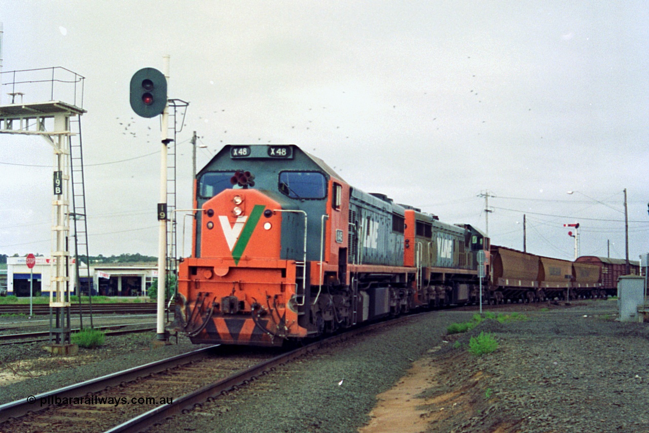 111-12
North Geelong C Box, V/Line broad gauge up Mt Gambier goods train 9192 heads around the Loop Line bound for Melbourne behind X class X 48 Clyde Engineering EMD model G26C serial 75-795 and older sister X 42 serial 70-705, signal post 19 is the down home signal for the Loop Line.
Keywords: X-class;X48;Clyde-Engineering-Rosewater-SA;EMD;G26C;75-795;