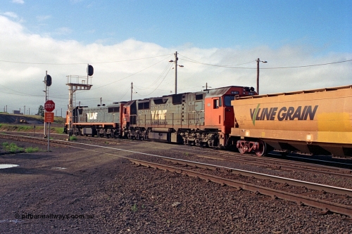 111-21
North Geelong grain arrivals yard, V/Line broad gauge loco X class X 47 Clyde Engineering EMD model G26C serial 75-794 and N class N 461 'City of Ararat' Clyde Engineering EMD model JT22HC-2 serial 86-1190, V/Line, running to grain loop with a loaded grain rake past signal posts 19 and 19B down home signals, trailing shot.
Keywords: X-class;X47;Clyde-Engineering-Rosewater-SA;EMD;G26C;75-794;