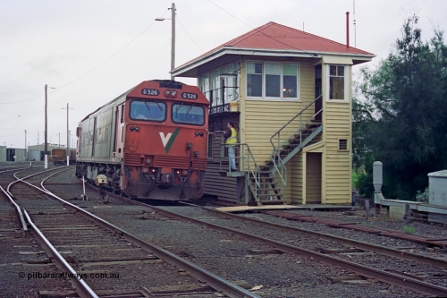 111-27
North Geelong C Box, V/Line broad gauge light loco G class G 526 Clyde Engineering EMD model JT26C-2SS serial 88-1256 surrenders the electric staff for to the Nth Geelong signaller for the section Nth Geelong B to Nth Geelong C, catch points, ground disc signal, point rodding, safeworking.
Keywords: G-class;G526;Clyde-Engineering-Somerton-Victoria;EMD;JT26C-2SS;88-1256;