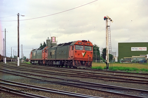 111-34
North Geelong yard, V/Line broad gauge light engines Series 1 G class leader G 511 Clyde Engineering EMD model JT26C-2SS serial 84-1239 and G 538 Clyde Engineering EMD model JT26C-2SS serial 89-1271 arrive at semaphore signal post 17 from Geelong loco depot destined for empty grain train 9123, track and yard view.
Keywords: G-class;G511;Clyde-Engineering-Rosewater-SA;EMD;JT26C-2SS;84-1239;