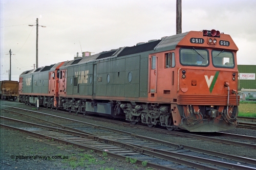 111-36
North Geelong yard, V/Line broad gauge light engines Series 1 G class leader G 511 Clyde Engineering EMD model JT26C-2SS serial 84-1239 and G class G 538 Clyde Engineering EMD model JT26C-2SS serial 89-1271 shunt onto the empty grain train 9123.
Keywords: G-class;G511;Clyde-Engineering-Rosewater-SA;EMD;JT26C-2SS;84-1239;