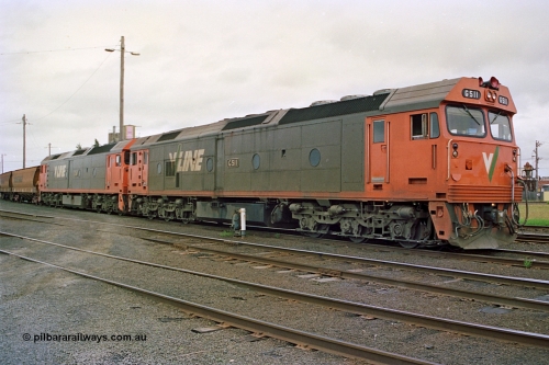 111-37
North Geelong yard, V/Line broad gauge grain train 9123 with power from locomotives Series 1 G class leader G 511 Clyde Engineering EMD model JT26C-2SS serial 84-1239 and G class G 538 Clyde Engineering EMD model JT26C-2SS serial 89-1271 sit beside electric ground dwarf signal 20 awaiting departure time.
Keywords: G-class;G511;Clyde-Engineering-Rosewater-SA;EMD;JT26C-2SS;84-1239;