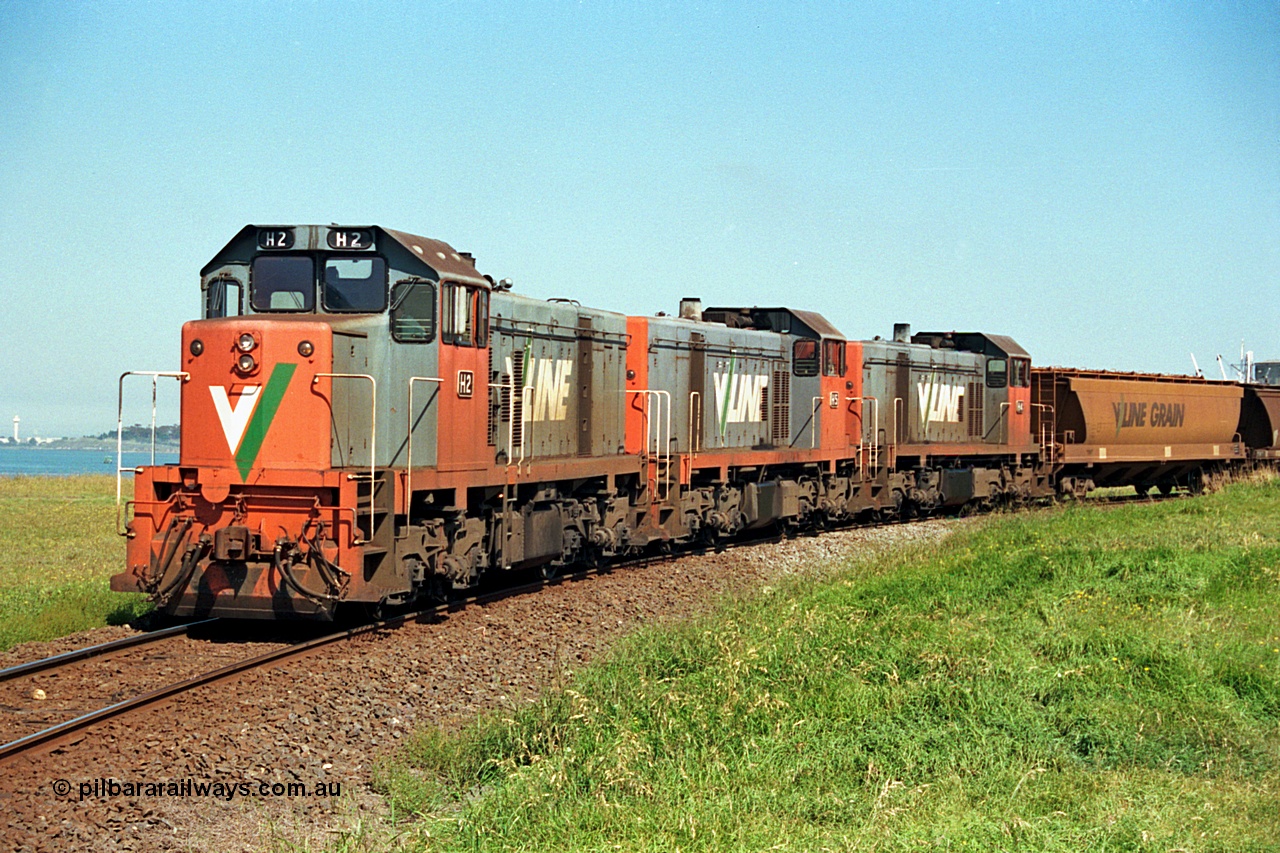 112-20
North Geelong grain loop, V/Line broad gauge locos H class H 2 Clyde Engineering EMD model G18B serial 68-630, H 5 serial 68-632 and H 4 serial 68-633 shunt around the grain loop unloading a grain train.
Keywords: H-class;H2;Clyde-Engineering-Granville-NSW;EMD;G18B;68-630;H5;68-632;H4;68-633;