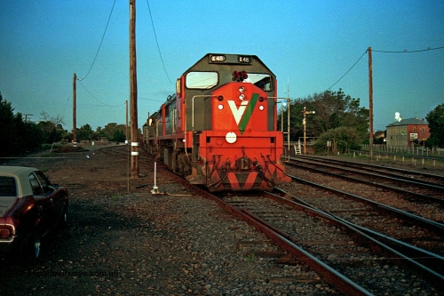 112-12
Benalla yard, broad gauge V/Line X class X 48 Clyde Engineering EMD model G26C serial 75-795 and two other X class with the Sunday up slab steel train 9334, having their crib break and to allow the evening passenger trains to run past prior to continuing to Long Island later in the evening, night shot, March 1994.
Keywords: X-class;X48;Clyde-Engineering-Rosewater-SA;EMD;G26C;75-795;