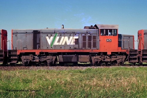 112-23
North Geelong grain loop, V/Line broad gauge H class H 5 Clyde Engineering EMD model G18B serial 68-632, RHS view, between sisters H 2 serial 68-630 and H 4 serial 68-633, grain loop unloading operations.
Keywords: H-class;H5;Clyde-Engineering-Granville-NSW;EMD;G18B;68-632;H2;68-630;H4;68-633;