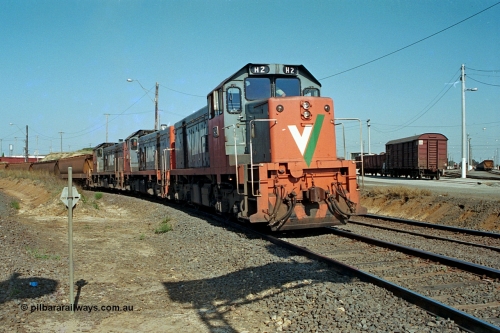 112-30
North Geelong C Box, on the North Goods Loop Line V/Line broad gauge H class locos H 2 Clyde Engineering EMD model G18B serial 68-630 leads sisters H 5 serial 68-632 and H 4 serial 68-633 back from the grain loop, Loop Line to Melbourne to left of frame, North Geelong yard to the right.
Keywords: H-class;H2;Clyde-Engineering-Granville-NSW;EMD;G18B;68-630;H5;68-632;H4;68-633;