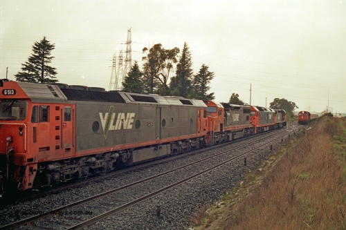 113-08
Warrenheip, V/Line broad gauge up Adelaide goods train 9150 behind the quad CGCG combo of C class C 506 Clyde Engineering EMD model GT26C serial 76-829, G class G 538 Clyde Engineering EMD model JT26C-2SS serial 89-1271, C class C 510 serial 76-833 and G class G 513 serial 85-1241, in miserable conditions, wait as a down passenger train with N class N 472 'City of Sale' Clyde Engineering EMD model JT22HC-2 serial 87-1201 and double N set passes.
Keywords: G-class;G513;Clyde-Engineering-Rosewater-SA;EMD;JT26C-2SS;85-1241;