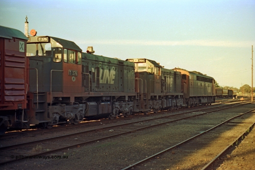 114-32
Benalla yard broad gauge V/Line S class leader S 300 'Matthew Flinders' Clyde Engineering EMD model A7 serial 57-164 and T classes T 404 Clyde Engineering EMD model G18B serial 67-499 and T 376 Clyde Engineering EMD model G8B serial 64-331, stabled on No. 5 Road with the down Wodonga goods train 9303, trailing view.
Keywords: S-class;S300;Clyde-Engineering-Granville-NSW;EMD;A7;57-164;bulldog;T-class;T404;G18B;67-499;T376;G8B;64-331;