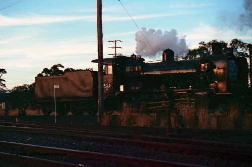115-16
Somerton, Steamrail broad gauge K class K 153 Victorian Railways built Consolidation model 2-8-0 steam locomotive on the Upfield with an enthusiasts special, about to cross Somerton Road, Steamrail special, looking across the North East running lines, Blue Circle location post, dwarf electric colour light shunting signals 11 for the SG line and 6 for the BG line.
Keywords: K-class;K153;Victorian-Railways-Newport-WS;Consolidation;2-8-0;