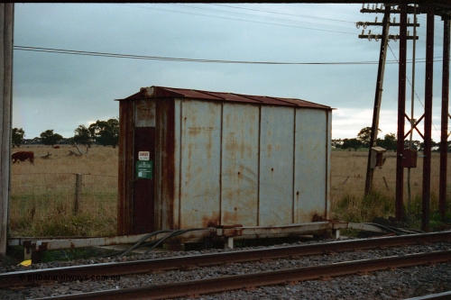 115-25
Somerton, opposite the broad gauge Siding A , interlocking cabinet, looking across broad gauge line, taken from yard.
