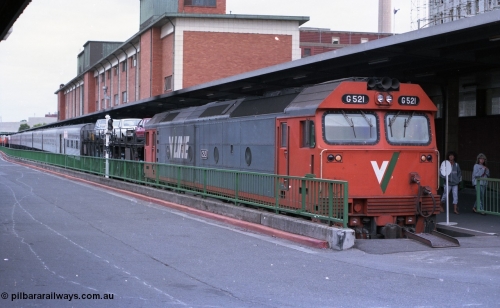 116-01
Spencer Street Station Platform No.1, V/Line standard gauge G class G 521 Clyde Engineering EMD model JT26C-2SS serial 85-1234 has arrived in Melbourne with the overnight train from Sydney, by the look of those hair styles it would have to be the very early 1990s!
Keywords: G-class;G521;Clyde-Engineering-Rosewater-SA;EMD;JT26C-2SS;85-1234;