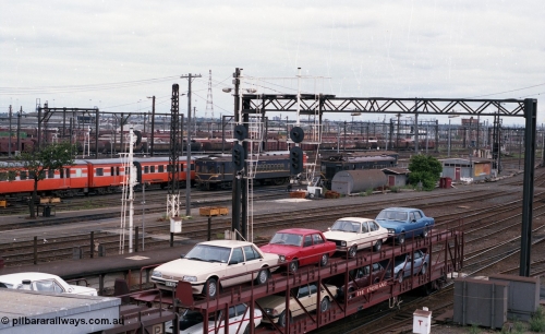 116-04
Spencer Street Station, view looking west from flyover, V/Line standard gauge yard pilot Y class Y 150 Clyde Engineering EMD model G6B serial 65-416 is waiting to shunt the overnight train from Sydney in platform No.1, shows the gauge separation point with the broad gauge line visible peeling off to the left, in the background are the 'Bank Sidings' where the country passenger fleet are stabled, with Dudley Street Sidings in the distance.
Keywords: Y-class;Y150;Clyde-Engineering-Granville-NSW;EMD;G6B;65-416;