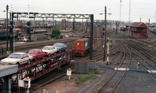 116-09
Spencer Street Station, view looking west from flyover, V/Line broad gauge Y class pilot Y 151 Clyde Engineering EMD model G6B serial 67-571 runs towards platform No.2 to collect the 'The Overland' Motorail waggons, DERMs 55 RM and 54 RM at left, West Tower in the middle background, Spencer Street No.1 Signal Box at right with broad gauge passenger stabling and maintenance sidings behind it, track work, points, searchlight signals and gantries and shunting signals.
Keywords: Y-class;Y151;Clyde-Engineering-Granville-NSW;EMD;G6B;67-571;