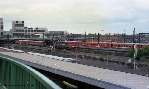 116-12
Spencer Street Station, view looking south from flyover, V/Line broad gauge passenger platforms, N class N 457 'City of Mildura' Clyde Engineering EMD model JT22HC-2 serial 85-1225 shunts away from an N set, behind it is a Victorian Railways 'Tea Cup' with V/Line liveried N set coupled to current V/Line liveried N set.
Keywords: N-class;N457;Clyde-Engineering-Somerton-Victoria;EMD;JT22HC-2;85-1225;