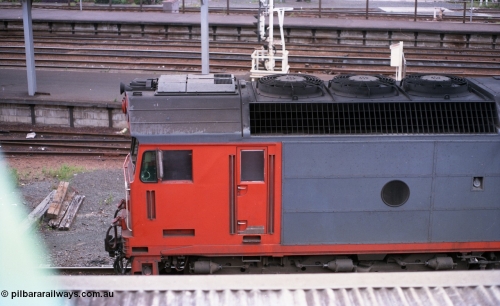116-16
Spencer Street Station, view from the flyover looking down upon V/Line standard gauge G class locomotive G 521 Clyde Engineering EMD model JT26C-2SS serial 85-1234, view of radiator and cab aircon unit.
Keywords: G-class;G521;Clyde-Engineering-Rosewater-SA;EMD;JT26C-2SS;85-1234;