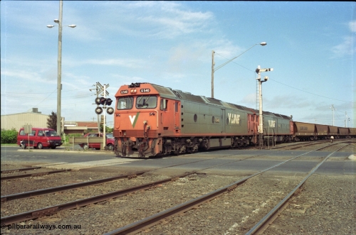 119-12
North Geelong C Box, V/Line broad gauge G class G 540 Clyde Engineering EMD model JT26C-2SS serial 89-1273 and sister depart with down empty grain train 9125, looking across Separation Street, semaphore signal post 16, grade crossing.
Keywords: G-class;G540;Clyde-Engineering-Somerton-Victoria;EMD;JT26C-2SS;89-1273;