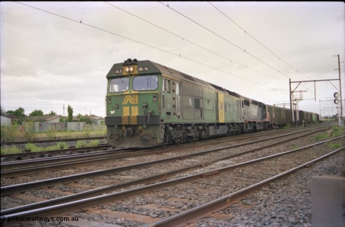 119-19
Sunshine, Australian National broad gauge loco BL class BL 31 Clyde Engineering EMD model JT26C-2SS serial 83-1015 and V/Line C class C 509 Clyde Engineering EMD model GT26C serial 76-832 with down Adelaide goods train 9149, on the Independent Goods Lines, crossing the passenger lines, semaphore signal post 31.
Keywords: BL-class;BL31;Clyde-Engineering-Rosewater-SA;EMD;JT26C-2SS;83-1015;