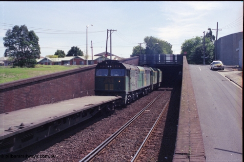 119-24
Bunbury Street Tunnel, Australian National broad gauge locos BL class BL 29 Clyde Engineering EMD model JT26C-2SS serial 83-1013 and 700 class 703 AE Goodwin ALCo model DL500G serial G6059-1 working down Adelaide bound goods train 9145 about to enter the tunnel, trailing view.
Keywords: 700-class;703;AE-Goodwin;ALCo;DL500G;G6059-1;