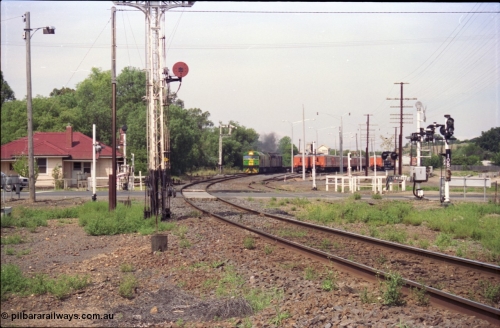 119-30
Bacchus Marsh, Australian National broad gauge locos BL class BL 29 Clyde Engineering EMD model JT26C-2SS serial 83-1013 and 700 class 703 AE Goodwin ALCo model DL500G serial G6059-1 with down Adelaide goods train 9145 power past the stabled passenger commuter carriage sets as they prepare to climb Islington Bank, semaphore signal post 7 is pulled off for move, signal post 10B is for moves from the former brown coal loading facility at Maddingley Brown Coal sidings.
Keywords: BL-class;BL29;Clyde-Engineering-Rosewater-SA;EMD;JT26C-2SS;83-1013;