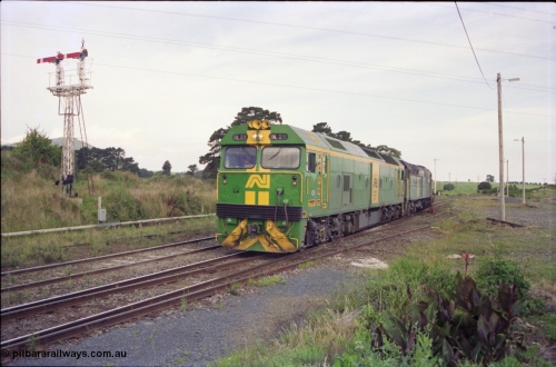 119-36
Warrenheip, Australian National broad gauge locos BL class BL 29 Clyde Engineering EMD model JT26C-2SS serial 83-1013 and 700 class 703 AE Goodwin ALCo model DL500G serial G6059-1 with down Adelaide goods train 9145 come off the Bacchus Marsh line at Warrenheip, following a 2 hour wait at Bungaree Loop, semaphore signal post 9 on the left.
Keywords: BL-class;BL29;Clyde-Engineering-Rosewater-SA;EMD;JT26C-2SS;83-1013;