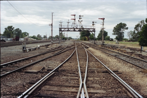 120-19
Benalla station yard, looking north, semaphore signal post 27 and gantry stripped dolls, tracks removed.
